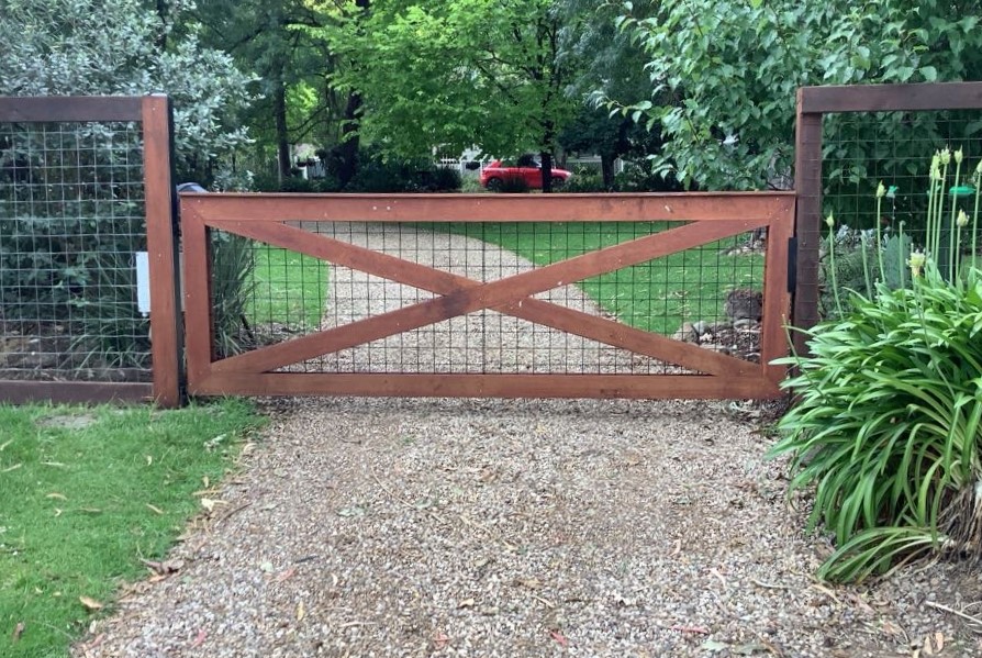 Timber swing gates with a simple frame design with cross-bracing cladding